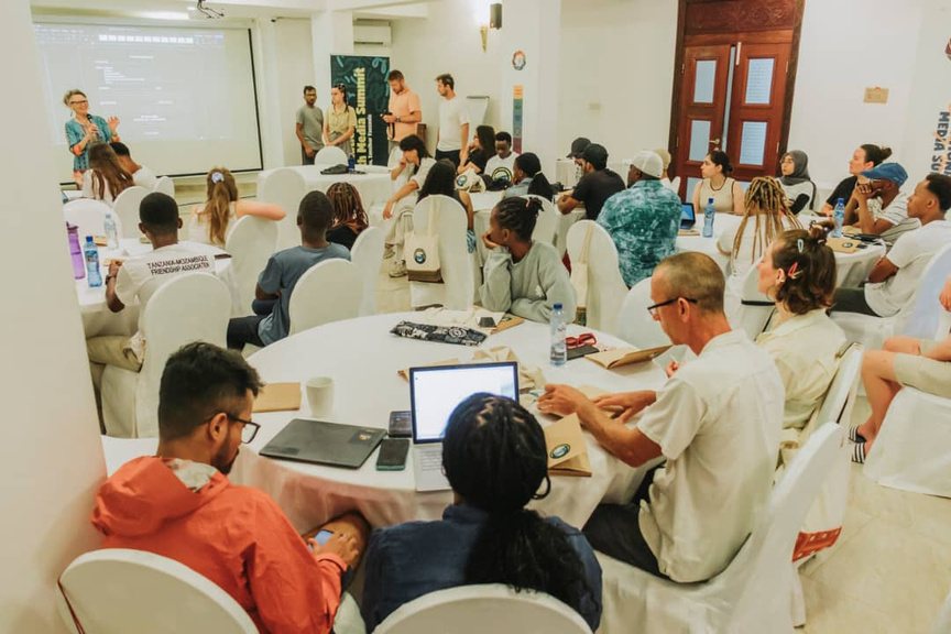 Delegates working in groups at an International Youth Media Summit workshop.